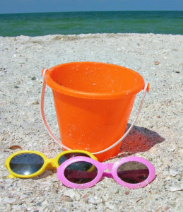 orange bucket with two pairs of sunglasses